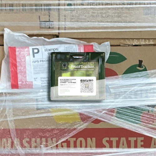Image of a ProofTracker affixed to a pallet of apples